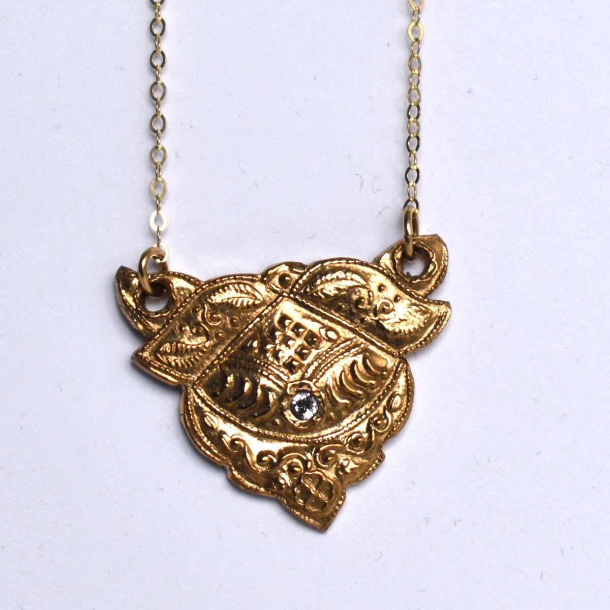 Handformed bronze necklace with CZ