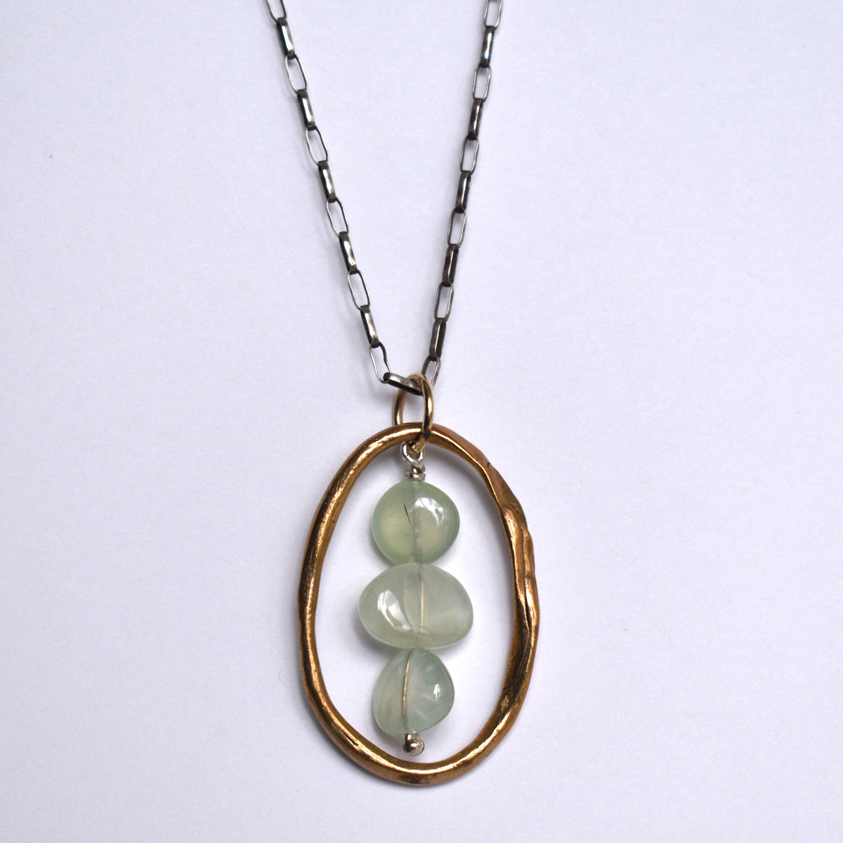 Handformed bronze oval with green agate necklace